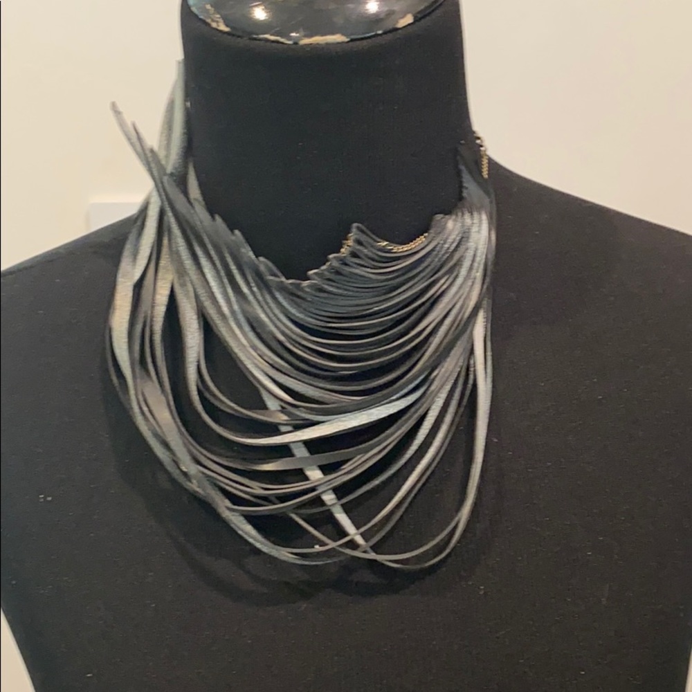Available for purchase with @7lions !!NWOT silver sprayed rubber wave necklace - Picture 1 of 4